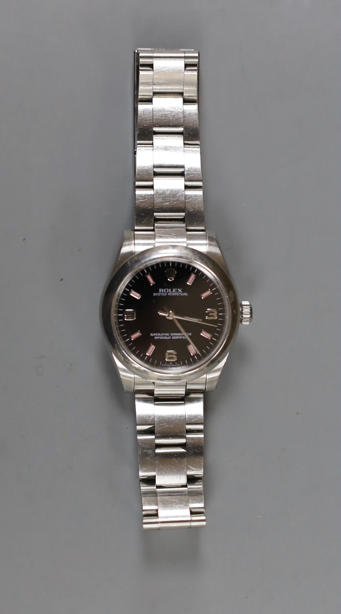A lady's 2011 stainless steel Rolex Oyster Perpetual wrist watch, on a stainless steel Rolex bracelet, case diameter 31mm, with box and certificate, model no. 177200, serial no. V958067.